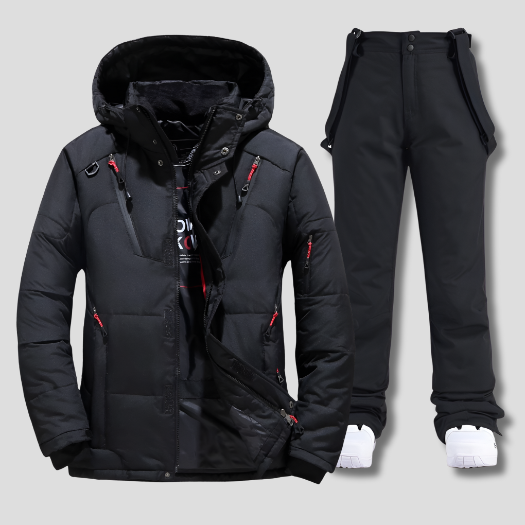 Hombre con conjunto de esquí Nortek en pista nevada, chaqueta y pantalón impermeables